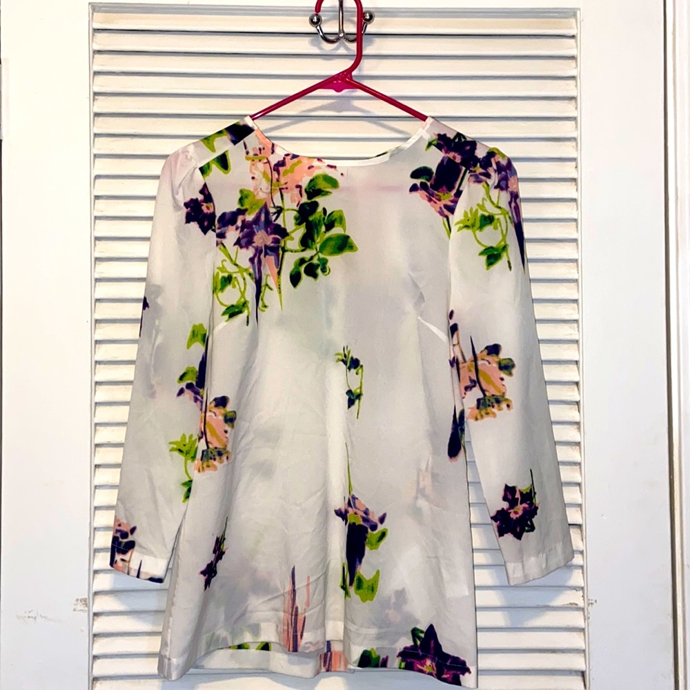 White/floral, 3/4 sleeve length blouse.